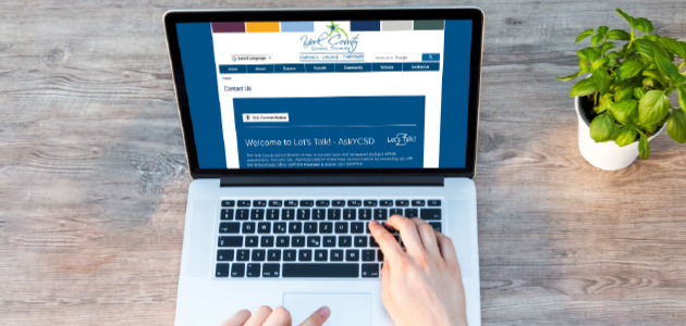 person typing on a laptop